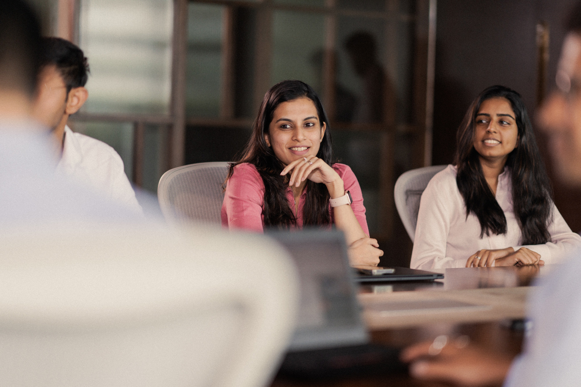 women in pink in a meeting
